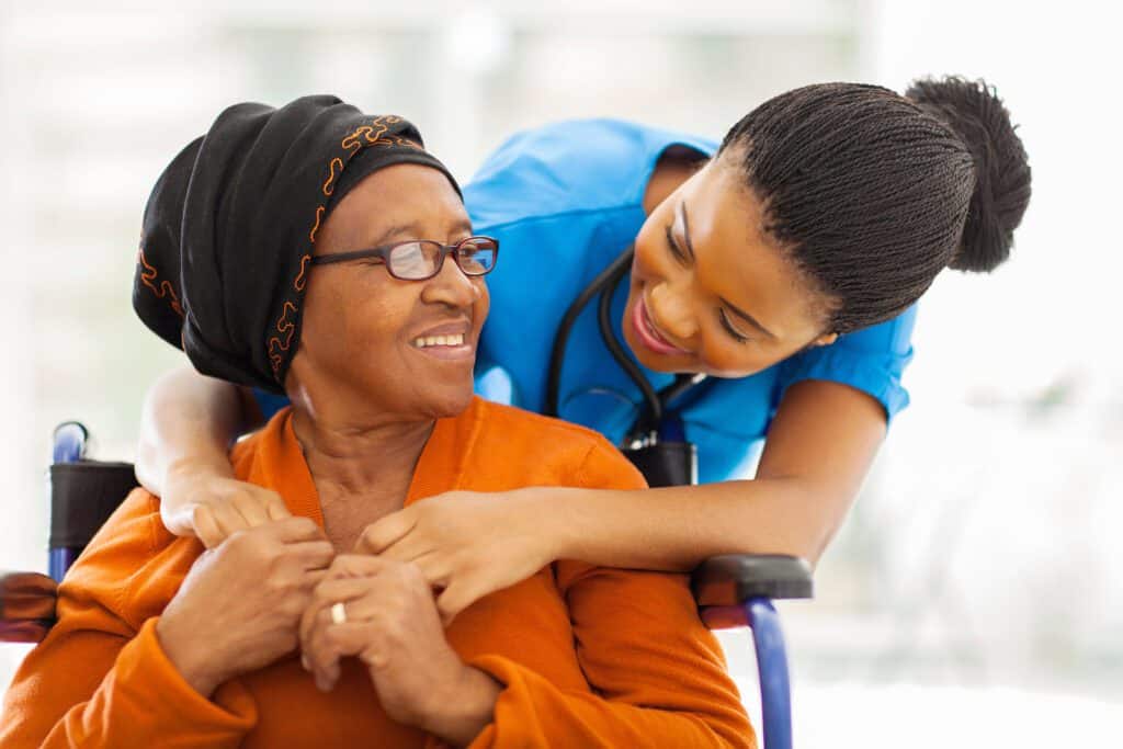 bigstock-happy-senior-patient-with-frie-49942211-1-1024x683
